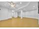 Spacious finished basement with painted concrete walls, drop ceiling and ceiling fan at 609 Old Wheat Ne St, Atlanta, GA 30312