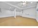 Large finished basement with painted concrete walls, recessed lights and ceiling fan at 609 Old Wheat Ne St, Atlanta, GA 30312