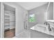 Bathroom view featuring double sinks with marble countertop and a closet for storage at 609 Old Wheat Ne St, Atlanta, GA 30312