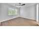 Well lit bedroom featuring an energy efficient ceiling fan, and hardwood style flooring at 609 Old Wheat Ne St, Atlanta, GA 30312