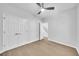 Clean, bright bedroom with hardwood floors, a ceiling fan, and a large closet with plenty of storage space at 609 Old Wheat Ne St, Atlanta, GA 30312