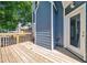 View of deck featuring wood plank floor, exterior of home, and surrounding foliage at 609 Old Wheat Ne St, Atlanta, GA 30312