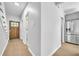 Bright entryway featuring hardwood floors and a solid wood front door, complemented by gray walls and cabinets at 609 Old Wheat Ne St, Atlanta, GA 30312