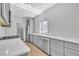 Modern kitchen featuring gray cabinetry, stainless steel appliances, and white countertops at 609 Old Wheat Ne St, Atlanta, GA 30312