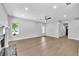 Open-concept living room with hardwood floors and a fireplace leading to the home entrance at 609 Old Wheat Ne St, Atlanta, GA 30312