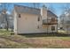 Back exterior of home with a deck at 1542 Bogota Way, Jonesboro, GA 30236