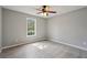 Neutral paint color and window makes this bedroom bright and cozy at 1542 Bogota Way, Jonesboro, GA 30236