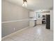 Cozy dining space featuring tile flooring and views into the updated kitchen at 1542 Bogota Way, Jonesboro, GA 30236