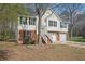 Beautiful house features a front-facing garage, stairs to front door, and front yard at 1542 Bogota Way, Jonesboro, GA 30236