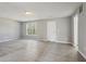 Large living room with white door and window at 1542 Bogota Way, Jonesboro, GA 30236