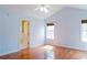 Bright bedroom with hardwood floors, ceiling fan and ensuite bathroom at 3045 Arden Ridge Dr, Suwanee, GA 30024