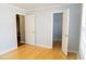 Bedroom with bamboo floors, two white doors, and a window providing light at 3045 Arden Ridge Dr, Suwanee, GA 30024