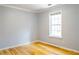 Inviting bedroom with bamboo floors and a window offering natural light at 3045 Arden Ridge Dr, Suwanee, GA 30024