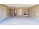 Functional garage with washer, dryer, water heater, and ample storage shelves at 3045 Arden Ridge Dr, Suwanee, GA 30024