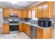 This kitchen features stainless steel appliances and granite countertops at 3045 Arden Ridge Dr, Suwanee, GA 30024