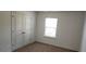 This bedroom features a closet, a window, and carpeted floors at 3512 Clear Creek Crossing, Kennesaw, GA 30144