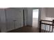 Hallway area with closet, neutral carpet and railing at 3512 Clear Creek Crossing, Kennesaw, GA 30144