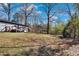 A vast backyard with wooded area and a deck that has steps leading down to it at 629 Moselle Sw Dr, Mableton, GA 30126