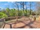 Spacious outdoor deck with railing overlooking a lush wooded area at 629 Moselle Sw Dr, Mableton, GA 30126