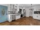 Bright modern kitchen featuring a stainless steel farmhouse sink and stainless appliances at 629 Moselle Sw Dr, Mableton, GA 30126