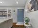 Cozy living room featuring hardwood floors, white walls, a blue door and stylish furnishings at 629 Moselle Sw Dr, Mableton, GA 30126