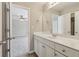 Bathroom vanity featuring white cabinets, a wide mirror, and view to another room at 3255 Blackburn Dr, Cumming, GA 30040