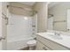 Well-lit bathroom featuring a shower-tub combo, white vanity, and chrome fixtures at 3255 Blackburn Dr, Cumming, GA 30040