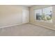 Comfortable bedroom with neutral carpet, a double-door closet, and ample natural light at 3255 Blackburn Dr, Cumming, GA 30040