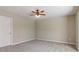 Bedroom featuring plush carpeting, a ceiling fan, and neutral paint at 3255 Blackburn Dr, Cumming, GA 30040