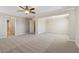 Spacious bedroom featuring neutral carpet and an ensuite bathroom entrance at 3255 Blackburn Dr, Cumming, GA 30040