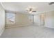 Spacious bedroom featuring plush carpet, neutral walls, and two bright windows at 3255 Blackburn Dr, Cumming, GA 30040
