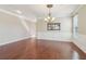 Dining room with chandelier, window and wainscoting at 3255 Blackburn Dr, Cumming, GA 30040
