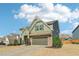 Attractive two-story home featuring neutral siding, stone accents, and a two-car garage at 3255 Blackburn Dr, Cumming, GA 30040