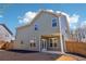 This home features a side-entry garage, a lawn and a covered patio at 3255 Blackburn Dr, Cumming, GA 30040