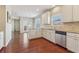 Bright kitchen with granite countertops, stainless steel appliances, and hardwood floors at 3255 Blackburn Dr, Cumming, GA 30040