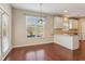 Eat-in kitchen features white cabinets, granite countertops and stainless appliances at 3255 Blackburn Dr, Cumming, GA 30040