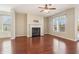 Bright living room with a fireplace, hardwood floors, and abundant natural light at 3255 Blackburn Dr, Cumming, GA 30040