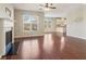 Cozy living room showcasing a fireplace, hardwood floors, and an open layout at 3255 Blackburn Dr, Cumming, GA 30040