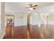 Expansive living room with hardwood floors, decorative columns, and an open kitchen view at 3255 Blackburn Dr, Cumming, GA 30040