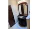 Elegant bathroom vanity featuring a black countertop, decorative cabinet, and unique mirror at 2894 Dellinger Dr, Marietta, GA 30062