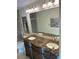 Bathroom featuring double sinks set in a marble countertop with tile flooring at 2894 Dellinger Dr, Marietta, GA 30062