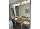 Spacious bathroom featuring double sink vanity with granite countertop and modern lighting at 2894 Dellinger Dr, Marietta, GA 30062