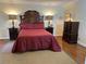 A well-lit bedroom features a large bed, two nightstands, and a tall dresser on top of a woven rug at 2894 Dellinger Dr, Marietta, GA 30062