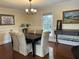 Formal dining room with chandelier, neutral walls, and rich hardwood floors at 2894 Dellinger Dr, Marietta, GA 30062