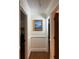 Hallway featuring hardwood floors, neutral walls, and elegant trim details at 2894 Dellinger Dr, Marietta, GA 30062