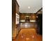 Functional kitchen with dark wood cabinets, modern appliances, and hardwood floors at 2894 Dellinger Dr, Marietta, GA 30062