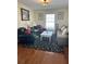 Cozy living room featuring hardwood floors, decorative rug, and comfortable seating arrangement at 2894 Dellinger Dr, Marietta, GA 30062