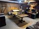 Rustic office featuring wood paneled walls, large desk, and built-in shelving at 2894 Dellinger Dr, Marietta, GA 30062