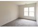 Bedroom with natural light, plush carpet, and neutral walls at 5150 Rockford Ln, Stockbridge, GA 30281