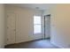 Bedroom featuring neutral walls and carpet, a single window, and a single door at 5150 Rockford Ln, Stockbridge, GA 30281